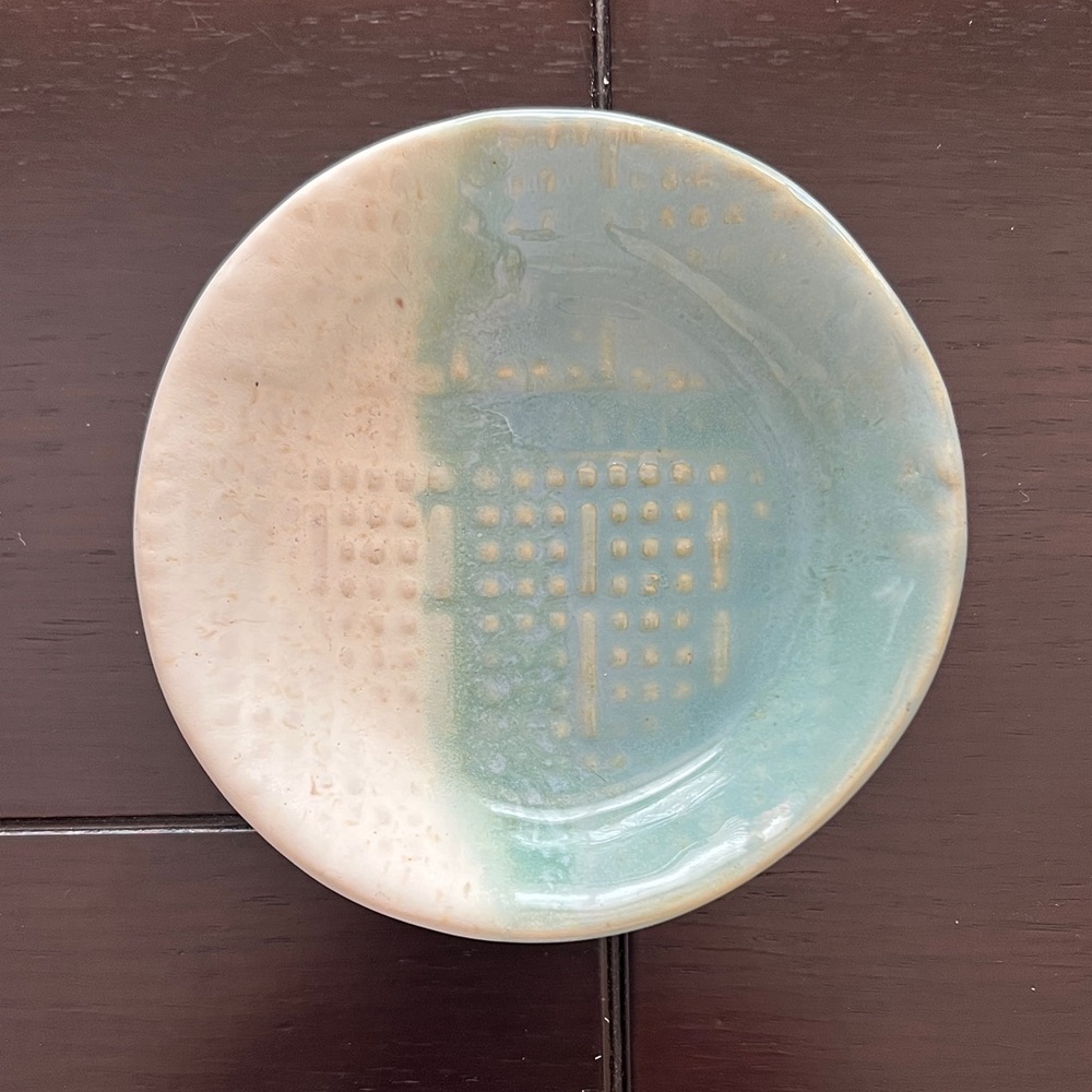 Elegant Pottery Dish with Blue and Cream Design